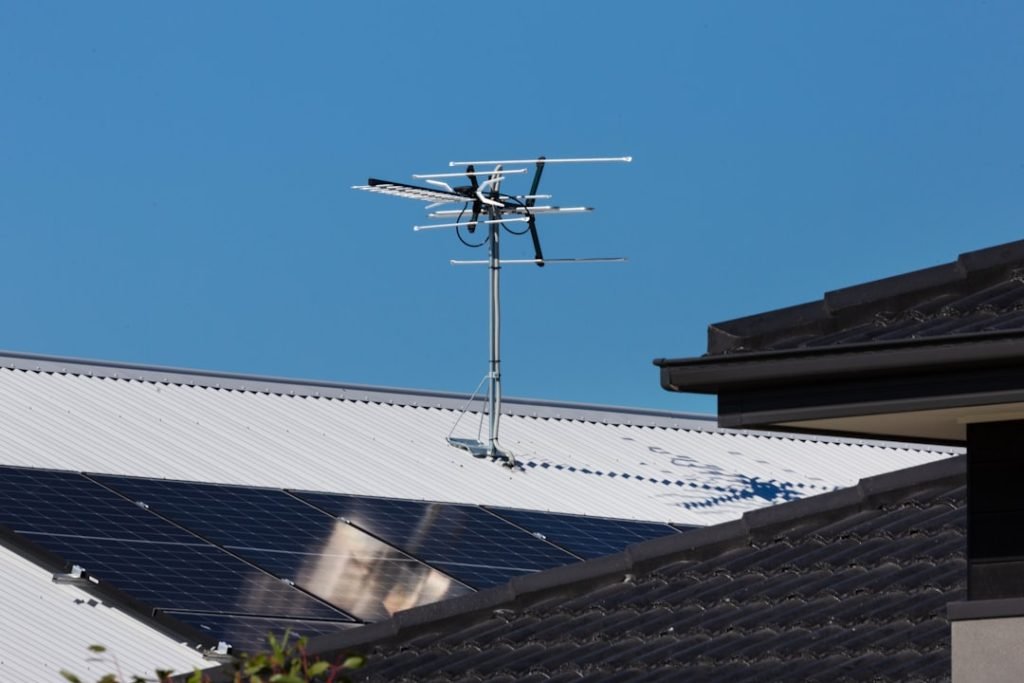 Mastering the First Impression: Your intriguing post title goes here Rooftop solar panels with TV antenna.